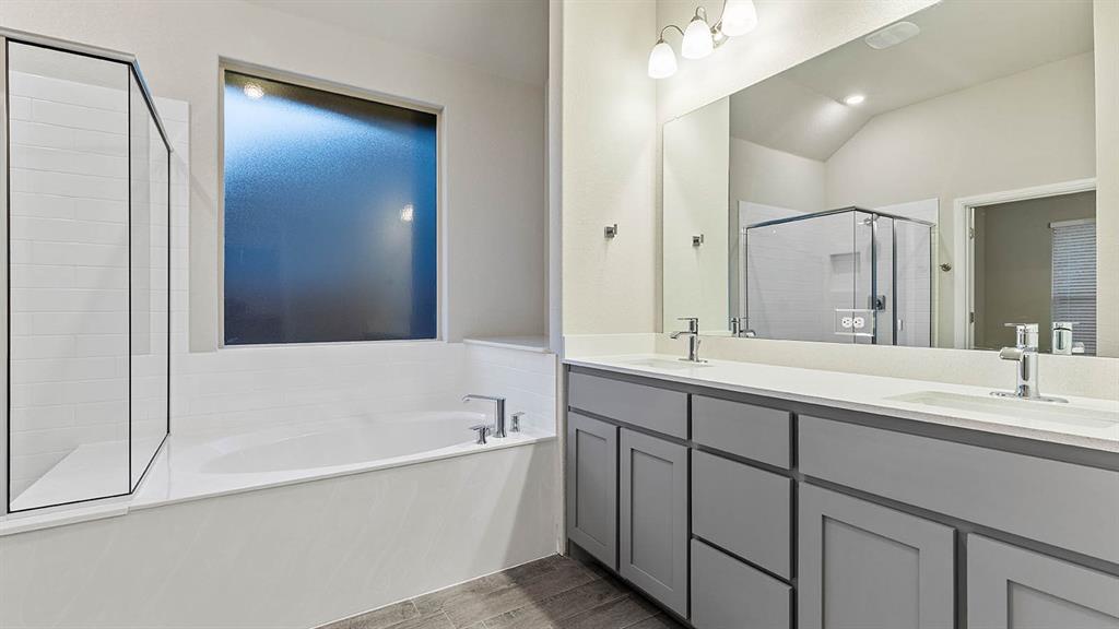 3275 Grayton Street Grand Prairie, TX 76065 - Photo 20 of 36 a bathroom with a tub sink and mirror