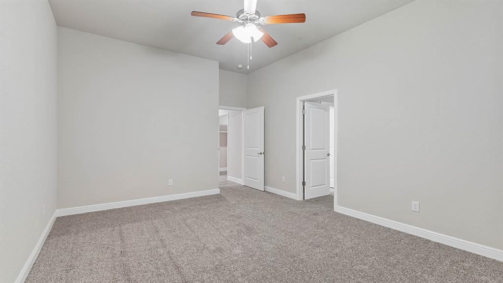 3275 Grayton Street Grand Prairie, TX 76065 - Photo 23 of 36 an empty room with closet and a chandelier fan