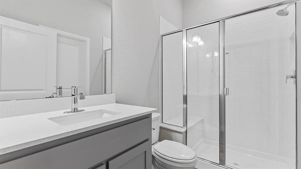 3275 Grayton Street Grand Prairie, TX 76065 - Photo 26 of 36 a bathroom with a sink toilet and shower