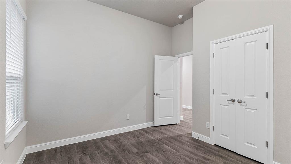 3275 Grayton Street Grand Prairie, TX 76065 - Photo 28 of 36 an empty room with wooden floor