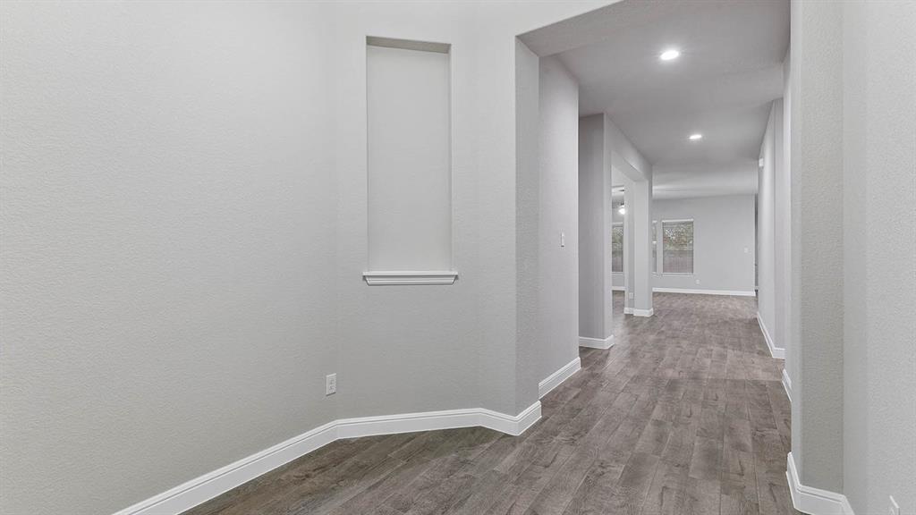 3275 Grayton Street Grand Prairie, TX 76065 - Photo 2 of 36 a view of a hallway with wooden floor