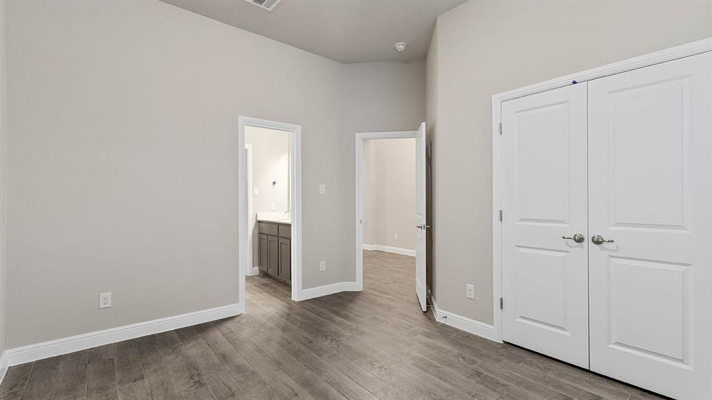 3275 Grayton Street Grand Prairie, TX 76065 - Photo 31 of 36 a view of an empty room and wooden floor
