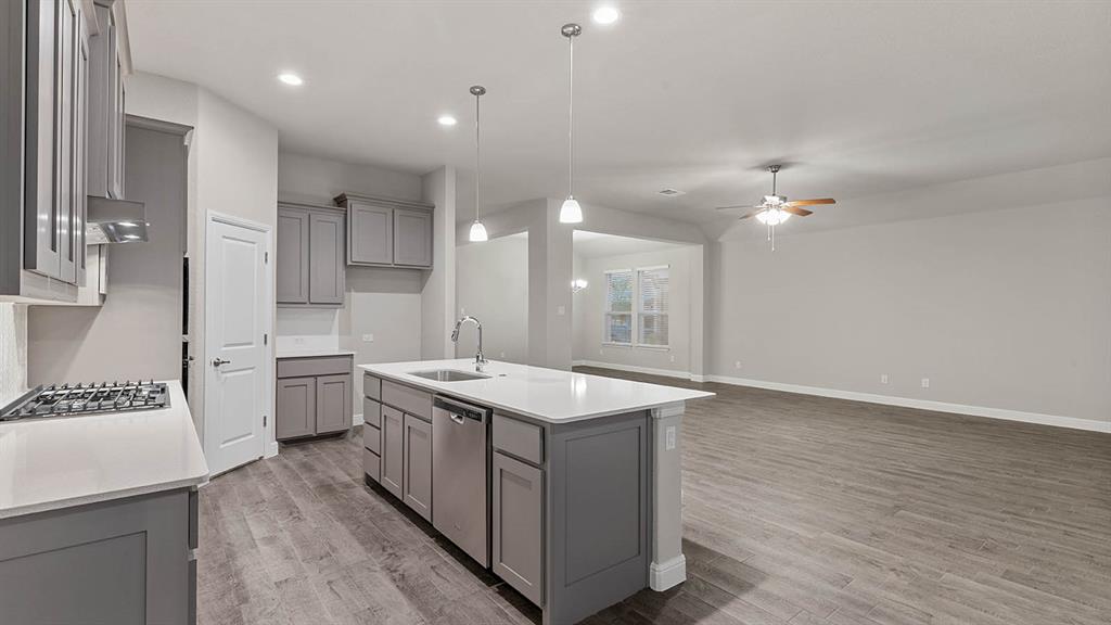 3275 Grayton Street Grand Prairie, TX 76065 - Photo 5 of 36 a kitchen with a sink and stove