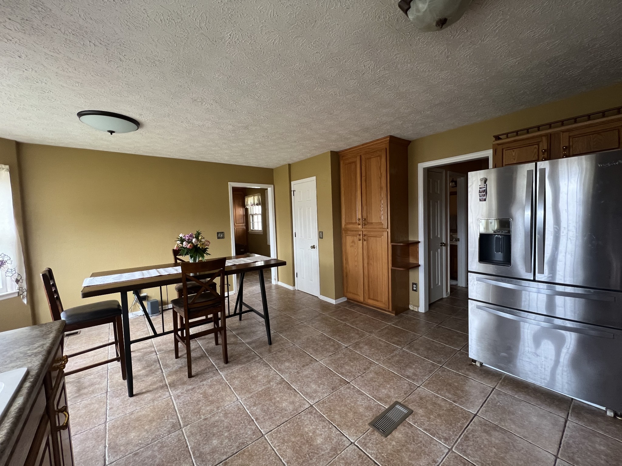 141 Buntin Mill Road Portland, TN 37148 - Photo 20 of 45 a view of a dining room with furniture and a refrigerator