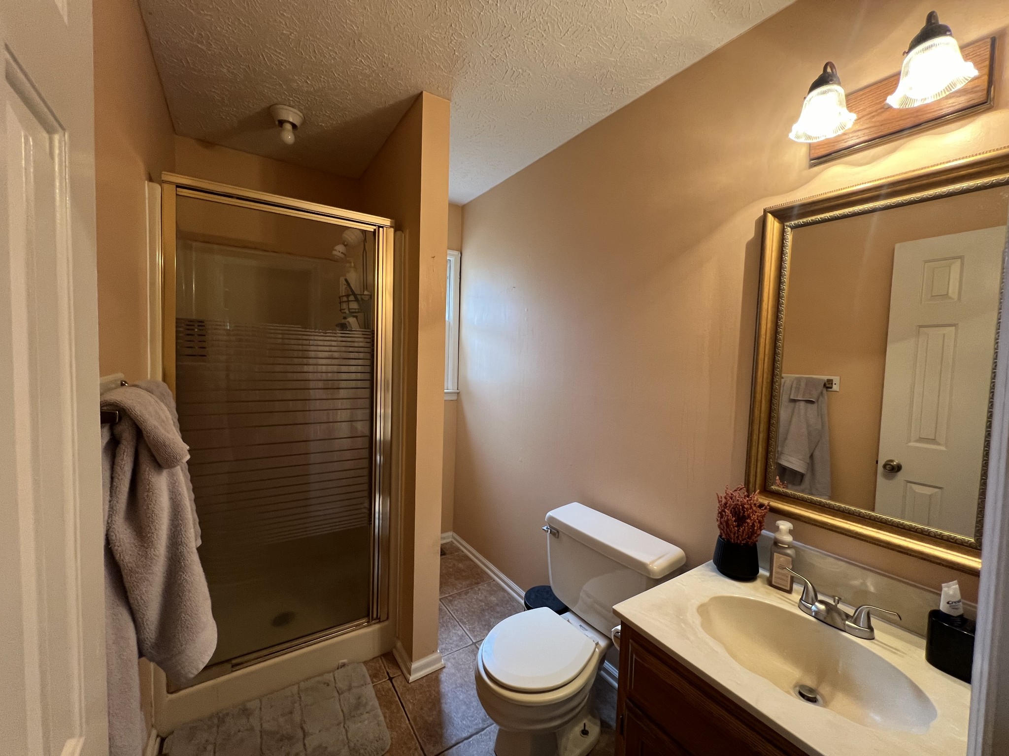 141 Buntin Mill Road Portland, TN 37148 - Photo 33 of 45 a bathroom with a sink a toilet and shower