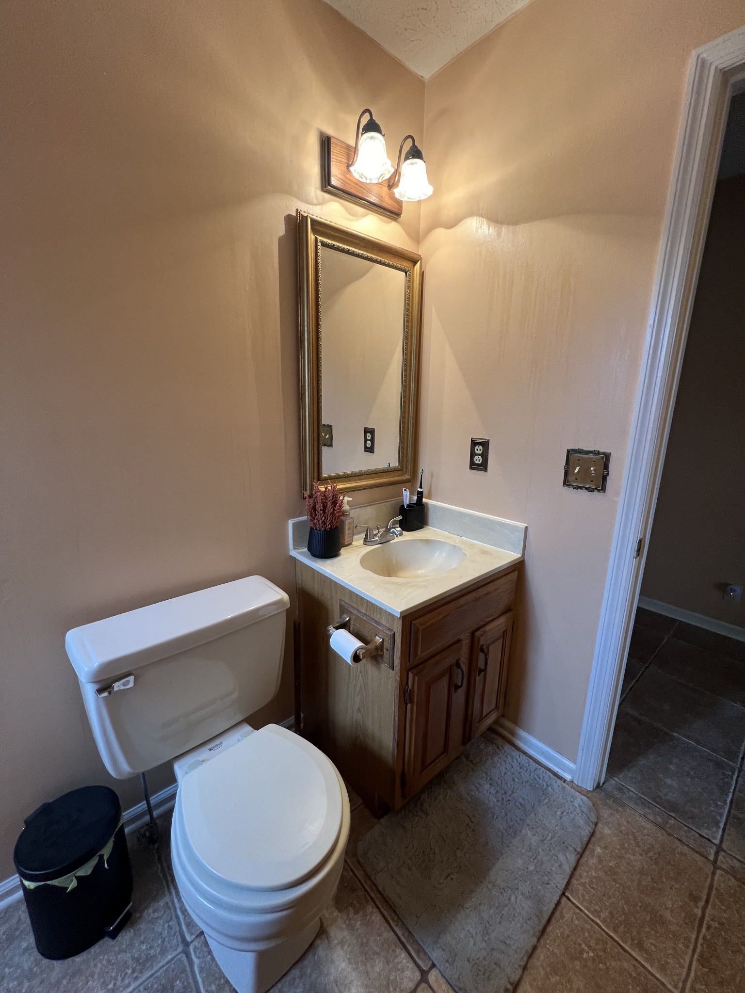 141 Buntin Mill Road Portland, TN 37148 - Photo 35 of 45 a bathroom with a toilet sink and mirror