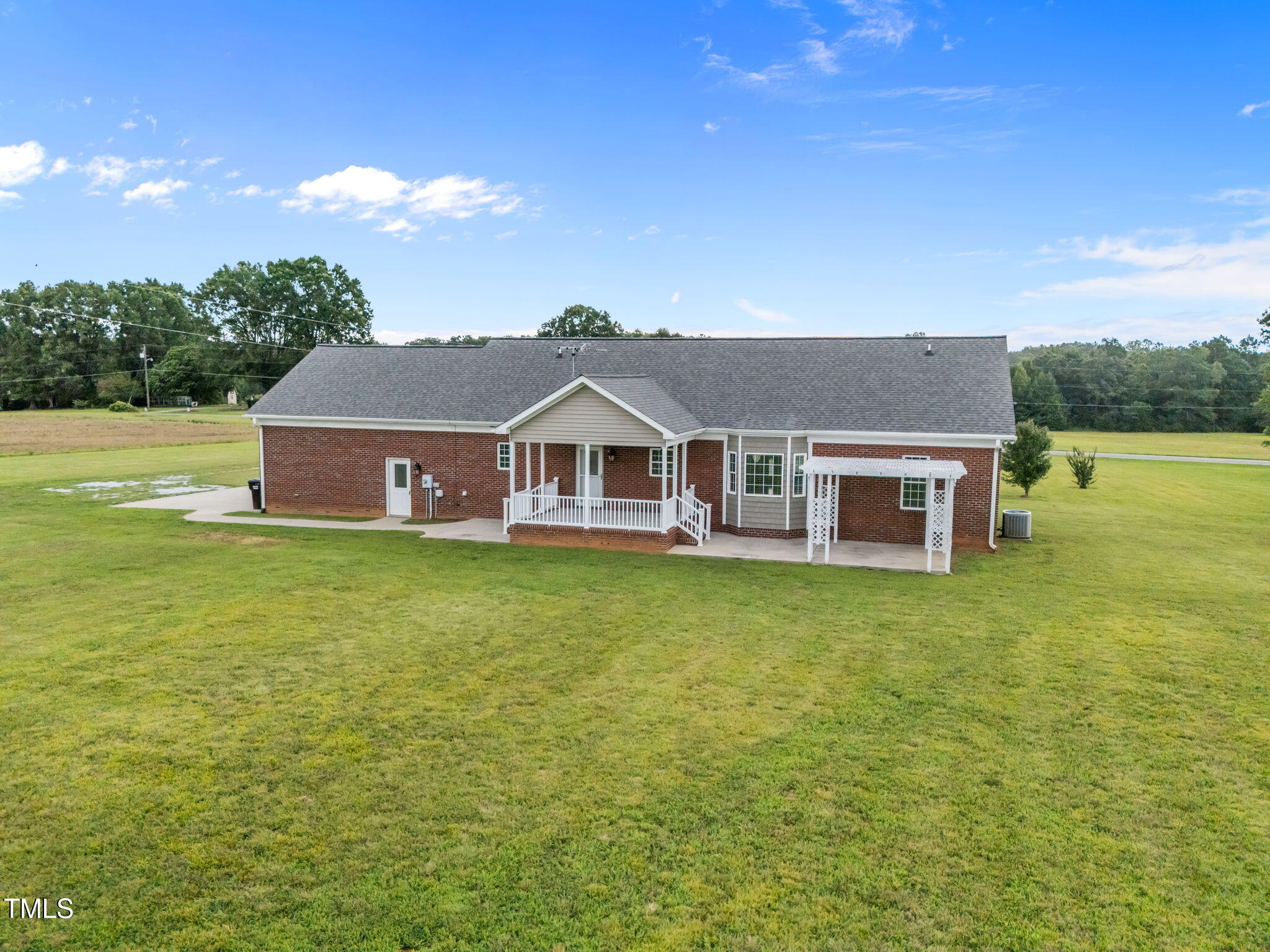 5556 Hurdle Mills Road Roxboro, NC 27574 - Photo 11 of 53 a aerial view of a house with garden and tree