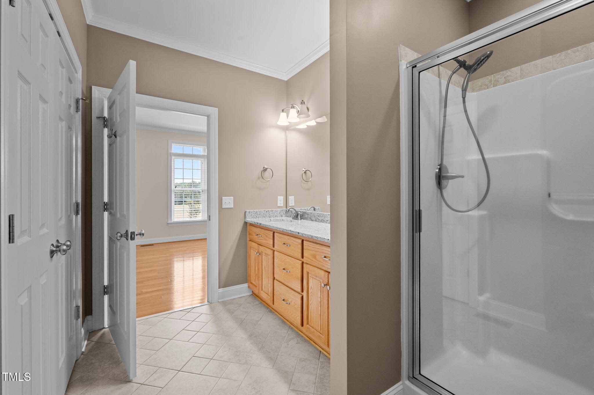 5556 Hurdle Mills Road Roxboro, NC 27574 - Photo 28 of 53 a bathroom with a granite countertop shower mirror and a sink