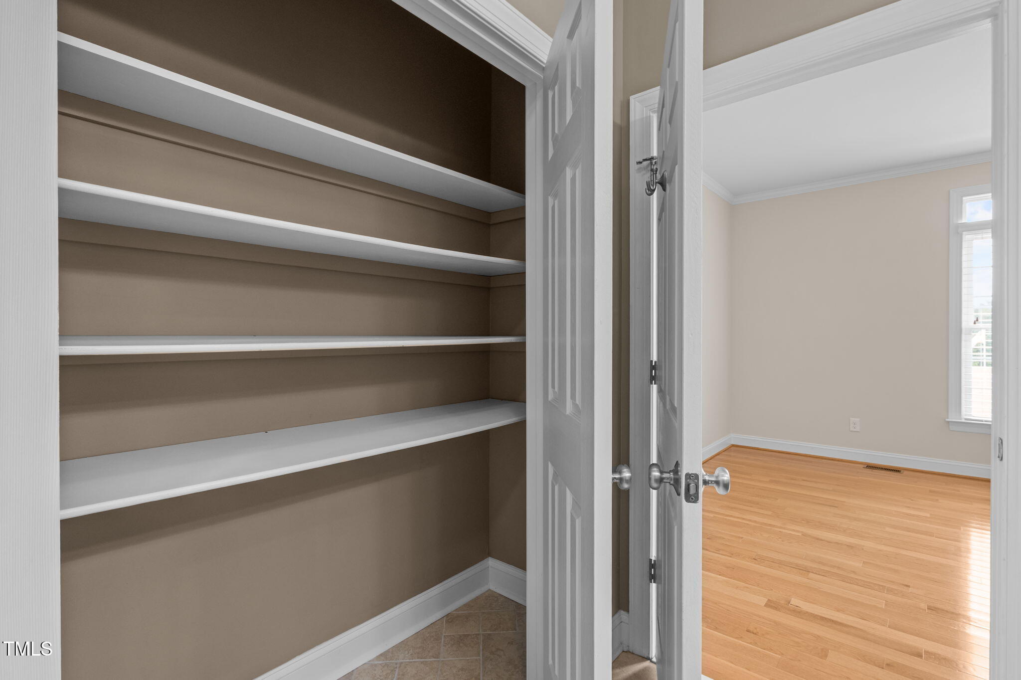 5556 Hurdle Mills Road Roxboro, NC 27574 - Photo 40 of 53 a view of walk in closet with empty racks