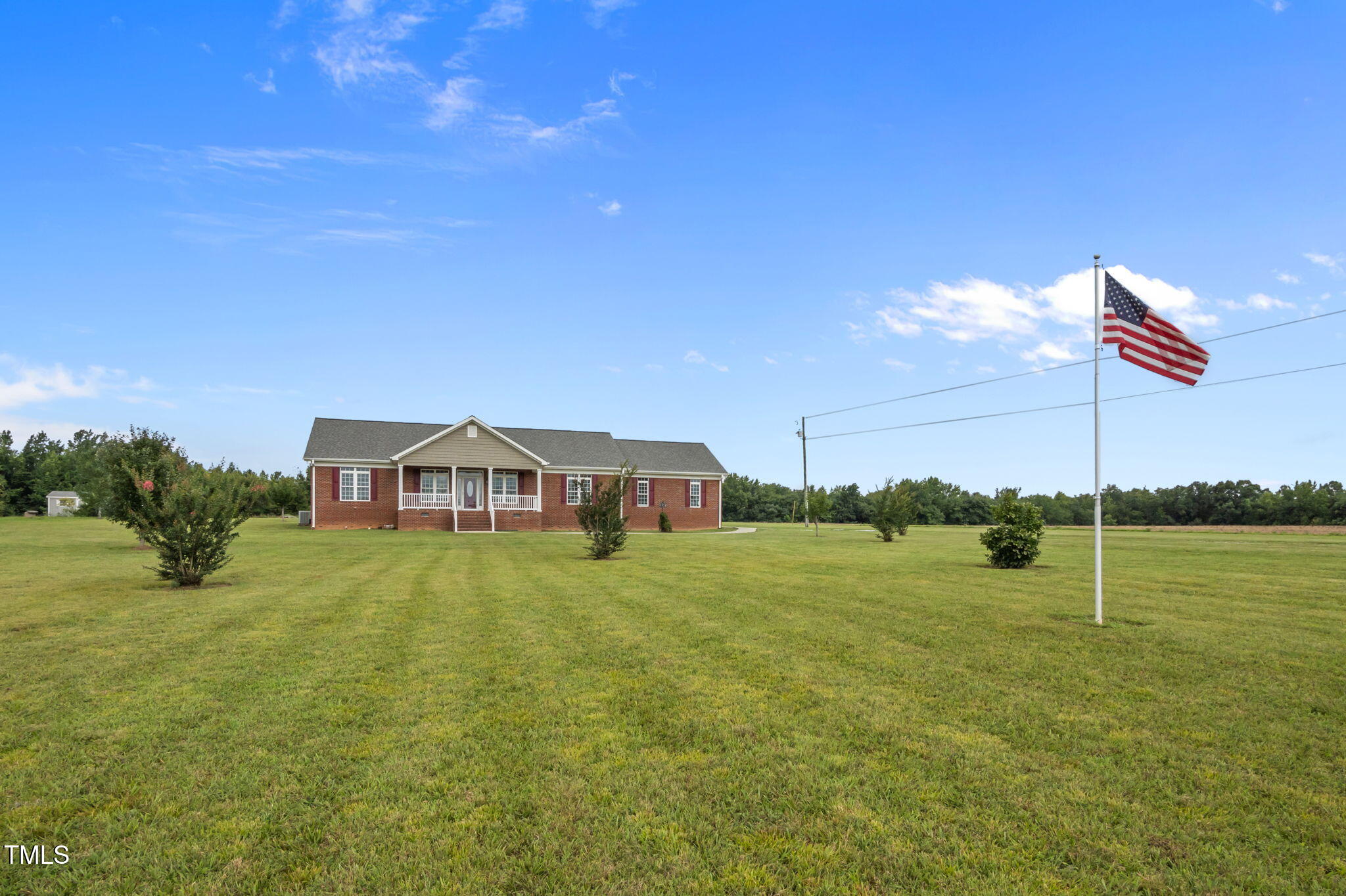 5556 Hurdle Mills Road Roxboro, NC 27574 - Photo 44 of 53 a big house with a big yard and large trees