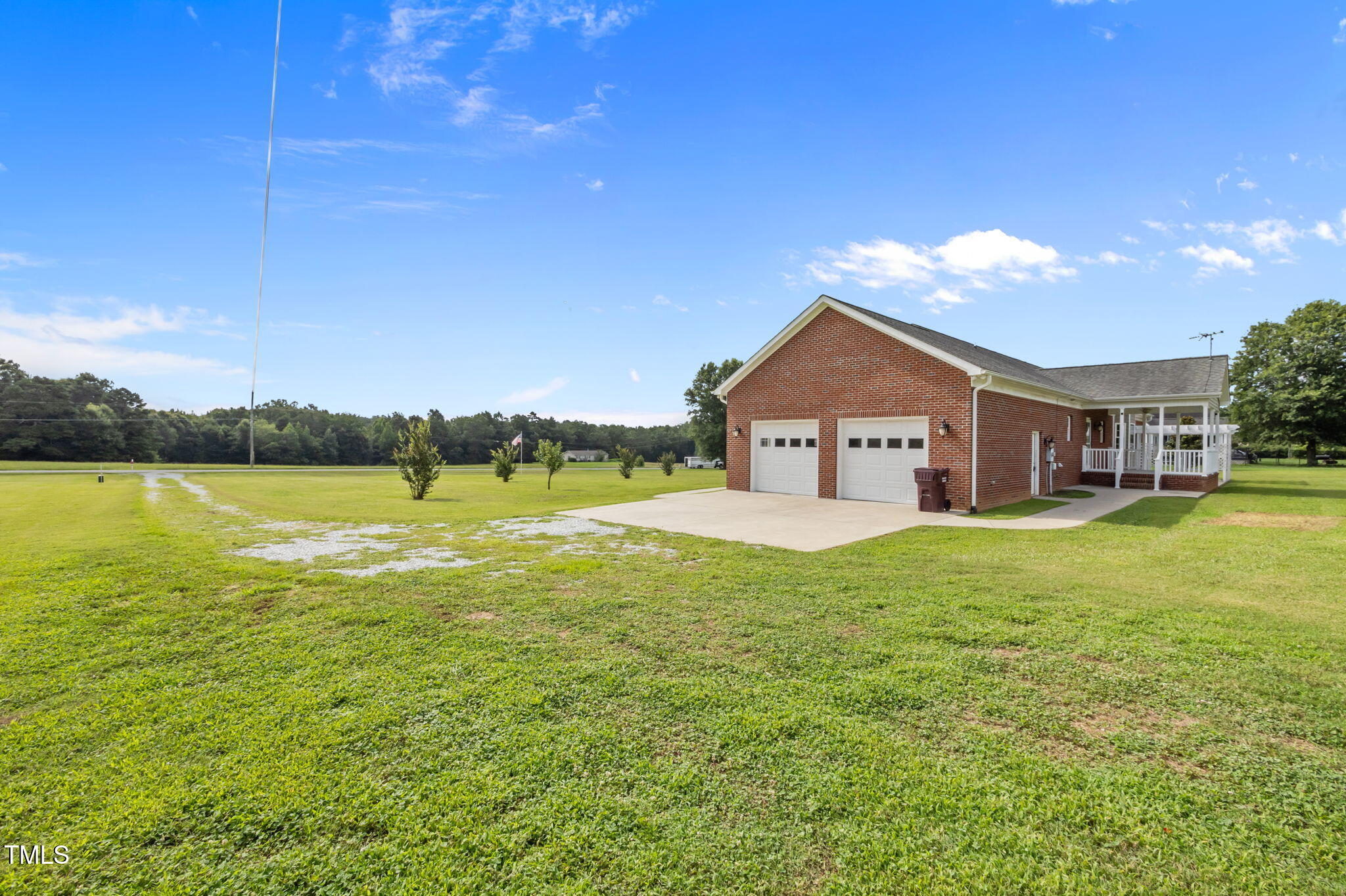 5556 Hurdle Mills Road Roxboro, NC 27574 - Photo 46 of 53 a view of a house with a yard