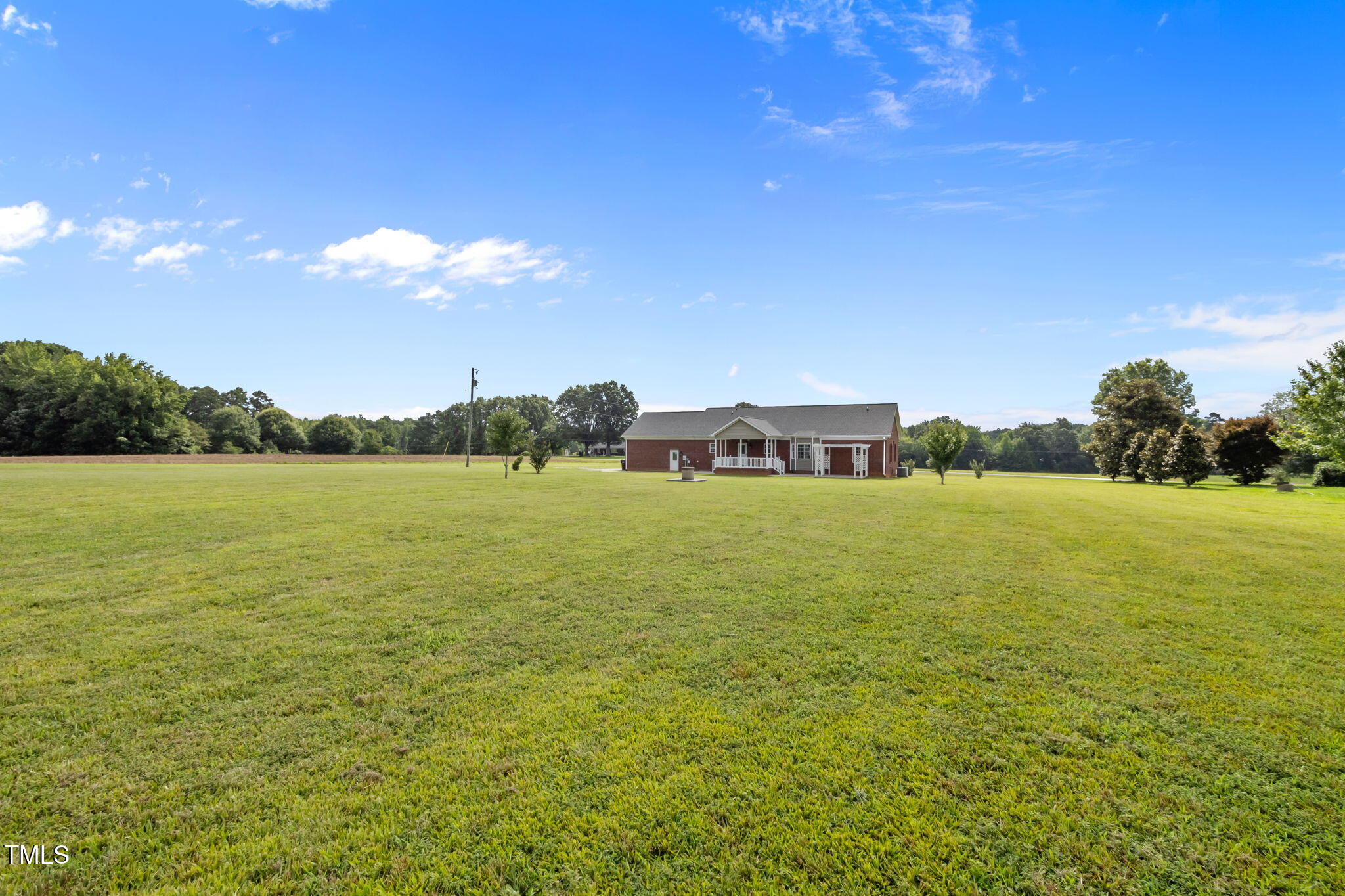 5556 Hurdle Mills Road Roxboro, NC 27574 - Photo 49 of 53 a view of a lake with houses in the background