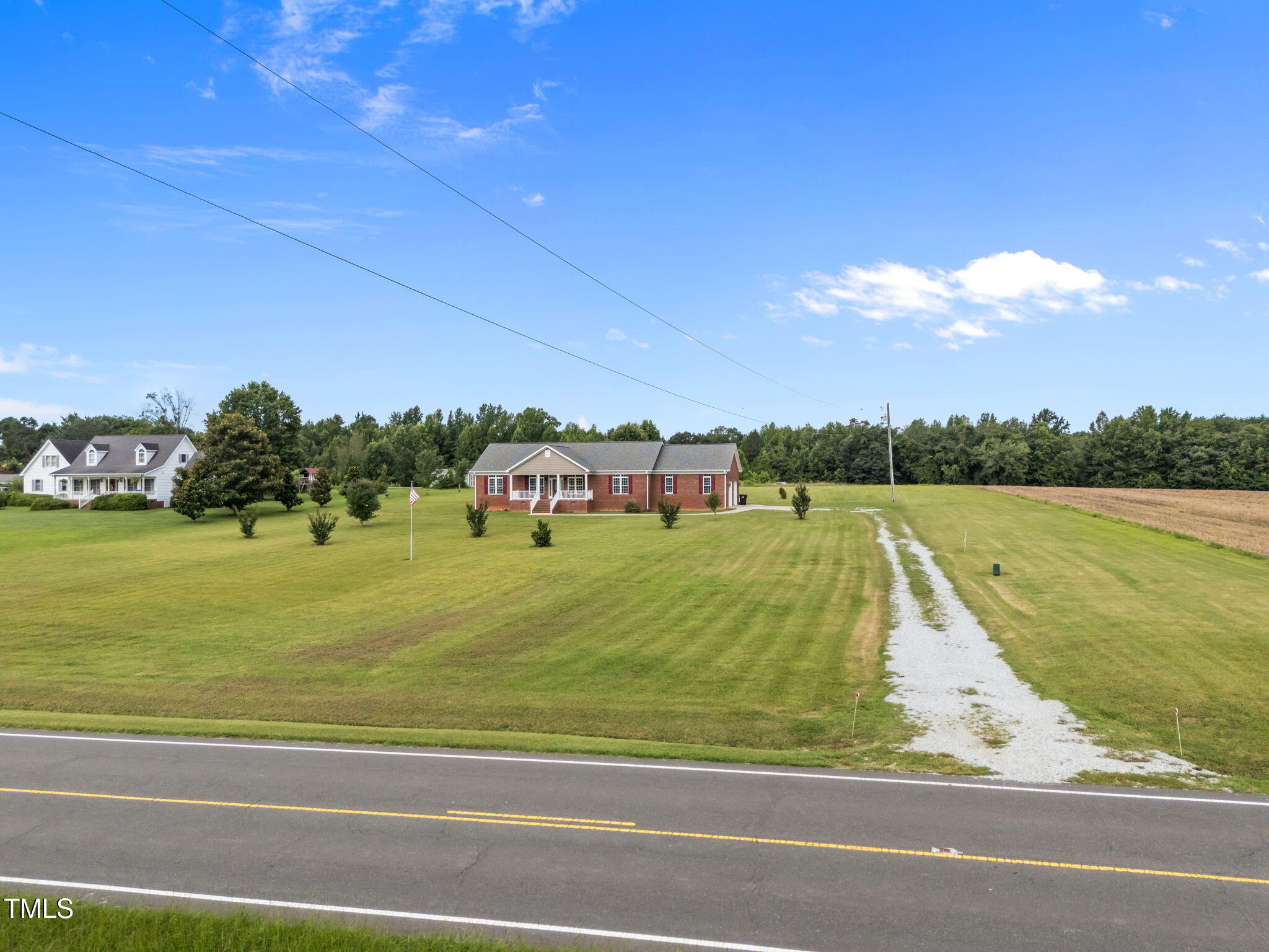 5556 Hurdle Mills Road Roxboro, NC 27574 - Photo 5 of 53 a view of a swimming pool and a yard