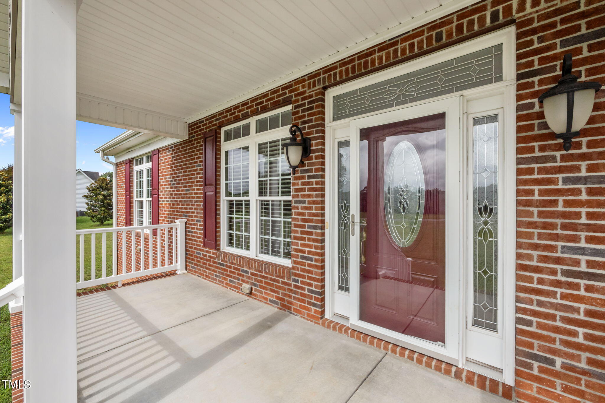 5556 Hurdle Mills Road Roxboro, NC 27574 - Photo 53 of 53 a view of a brick house with a door