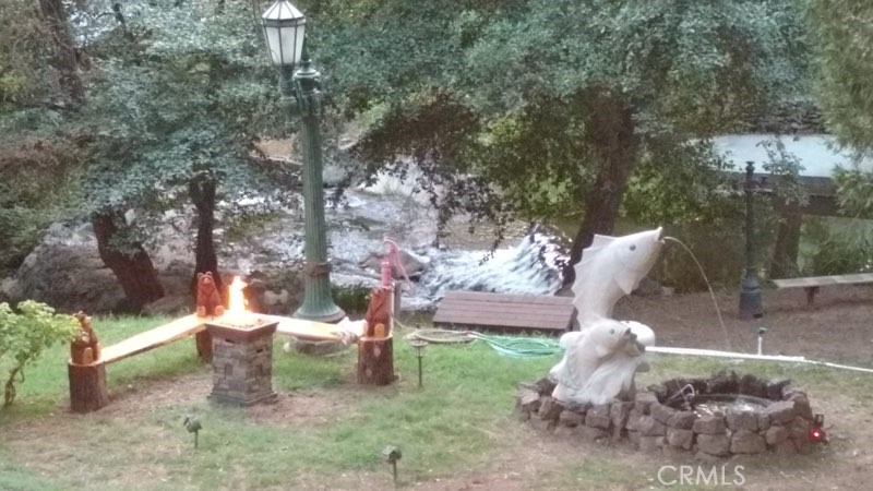 2601 Murphys Grade Road Murphys, CA 95247 - Photo 3 of 7 a view of a yard with a tree and a fire pit