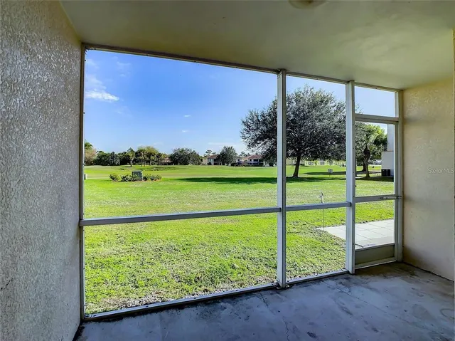 a view of a room with a large window
