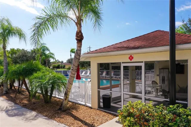 a backyard of a house with palm tree
