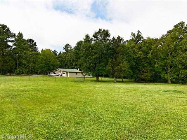 1623 Buckhorn Road Mebane, NC 27302 - Photo 15 of 16 Exterior Back. Large Fenced in Backyard