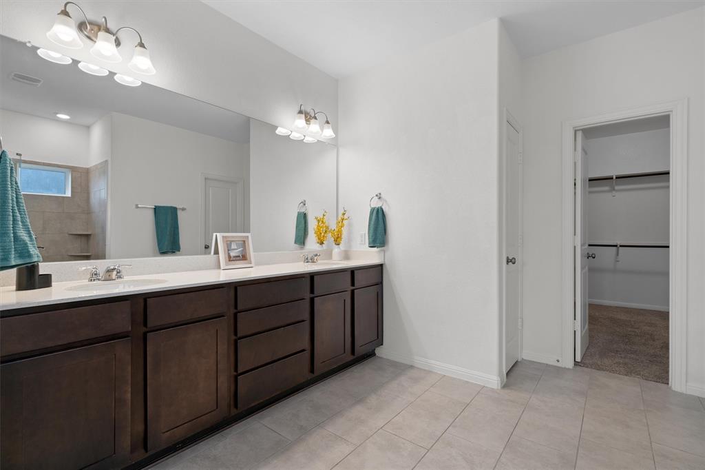 236 Prato Place Georgetown, TX 78628 - Photo 20 of 40 Double vanity with quartz countertops and spacious mirror for everyday convenience.