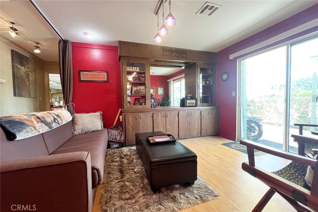119 Del Mar Rancho Mirage, CA 92270 - Photo 11 of 40 a living room with furniture and a large window