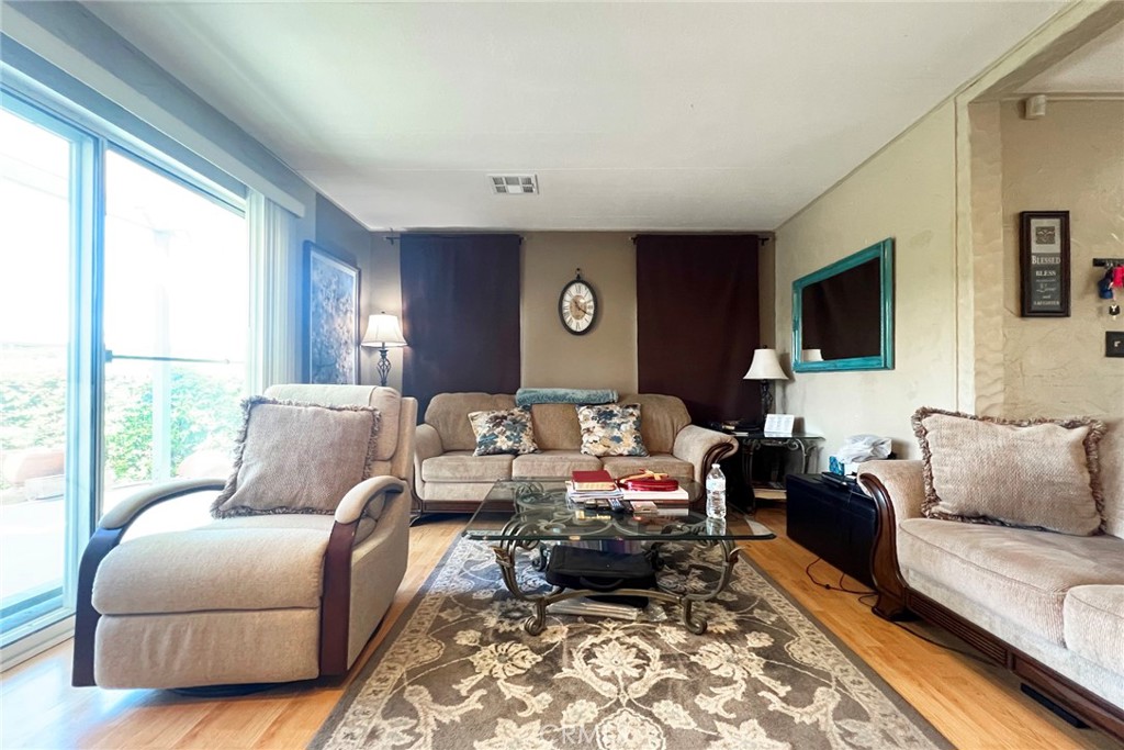 119 Del Mar Rancho Mirage, CA 92270 - Photo 12 of 40 a living room with furniture or couch and a large window