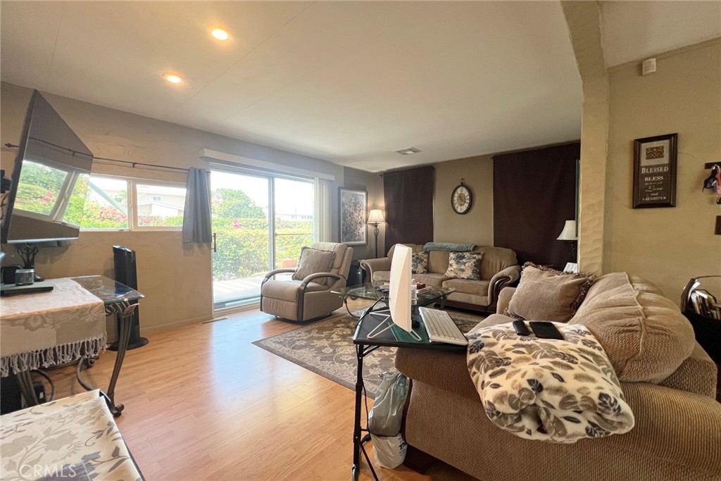 119 Del Mar Rancho Mirage, CA 92270 - Photo 13 of 40 a living room with furniture and large windows
