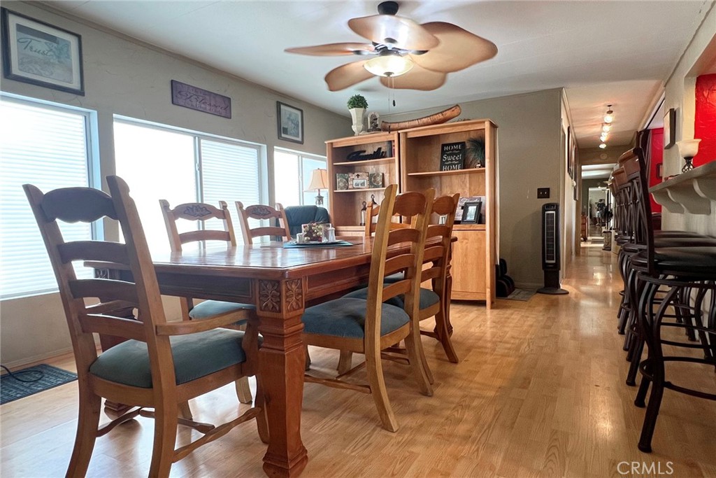 119 Del Mar Rancho Mirage, CA 92270 - Photo 15 of 40 a view of a dining room with furniture window and wooden floor