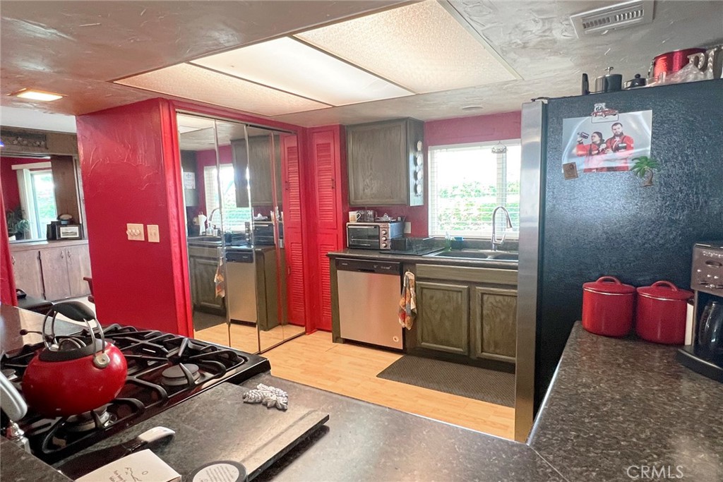 119 Del Mar Rancho Mirage, CA 92270 - Photo 18 of 40 a kitchen with a sink stove and refrigerator