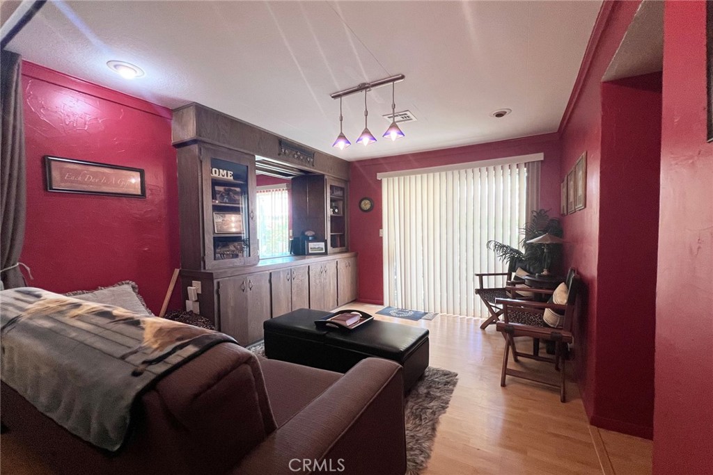 119 Del Mar Rancho Mirage, CA 92270 - Photo 22 of 40 a bedroom with furniture and wooden floor