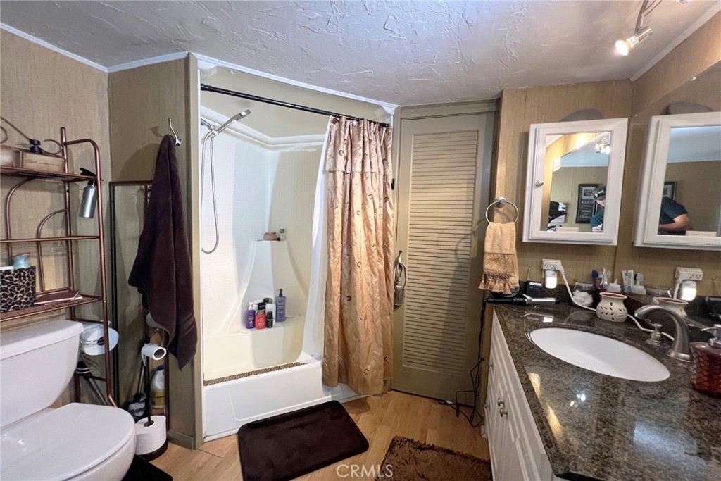 119 Del Mar Rancho Mirage, CA 92270 - Photo 25 of 40 a bathroom with a sink a toilet a mirror and shower