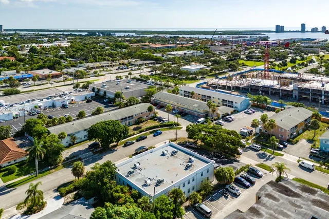an aerial view of residential building and lake