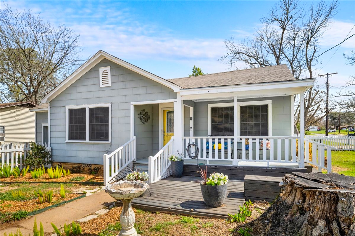 1107 Washington Street Brenham, TX 77833 - Photo 2 of 19 a view of a house with a patio