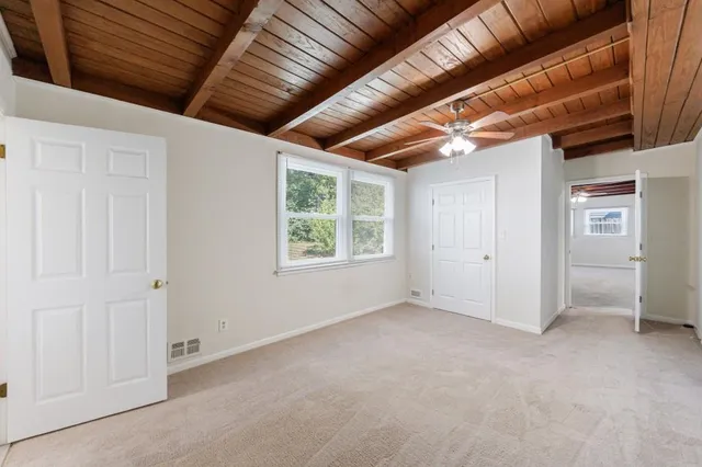 a view of empty room with windows