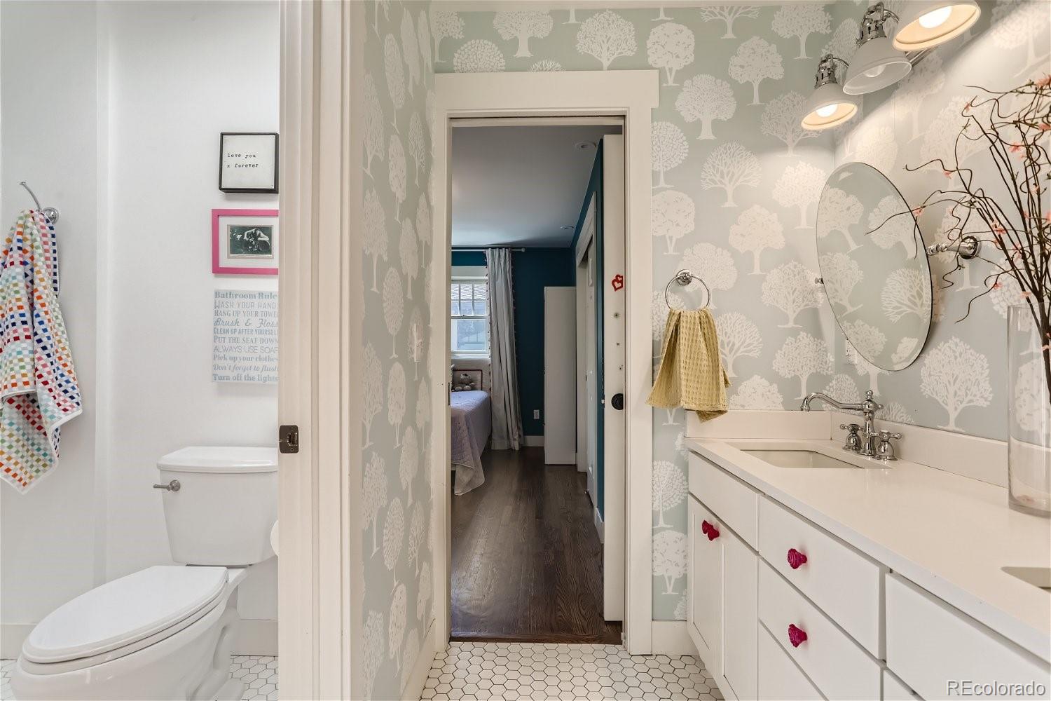 6650 Crestbrook Drive Morrison, CO 80465 - Photo 16 of 38 a bathroom with a sink a toilet and shower