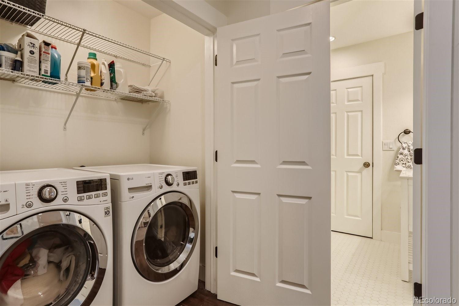 6650 Crestbrook Drive Morrison, CO 80465 - Photo 25 of 38 a view of a hallway with washer and dryer