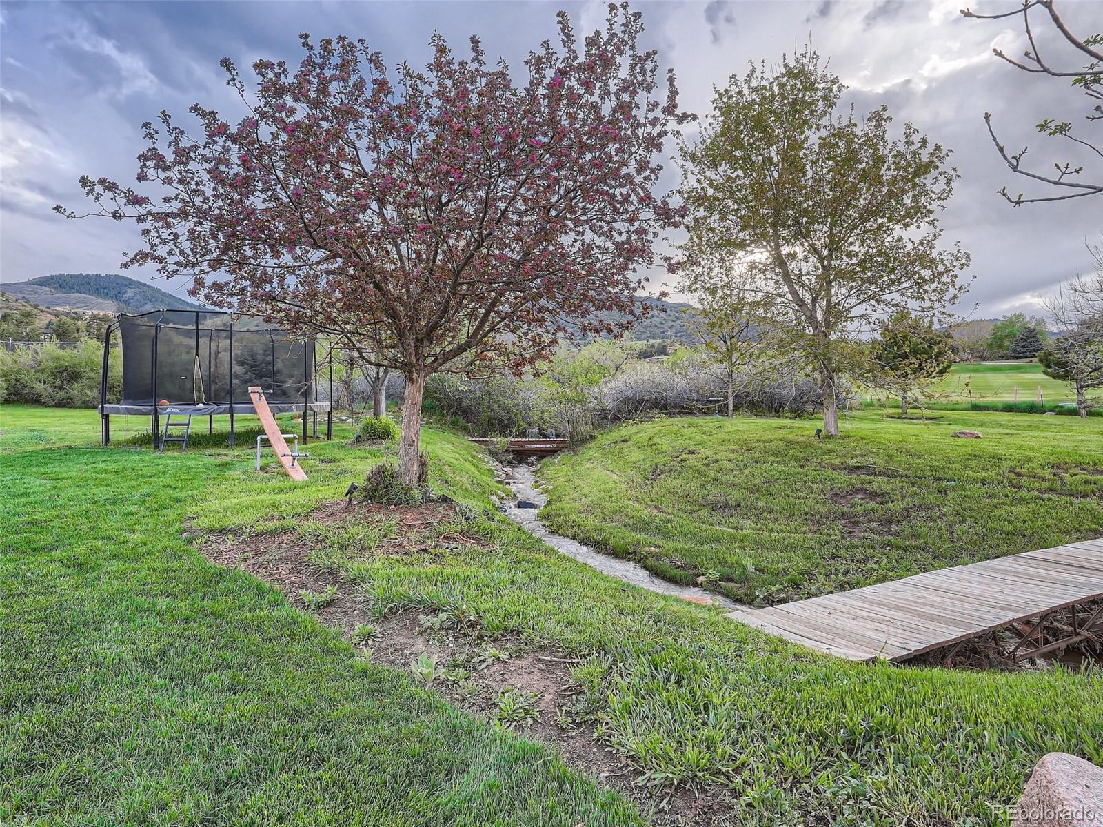 6650 Crestbrook Drive Morrison, CO 80465 - Photo 32 of 38 a view of a park with large trees