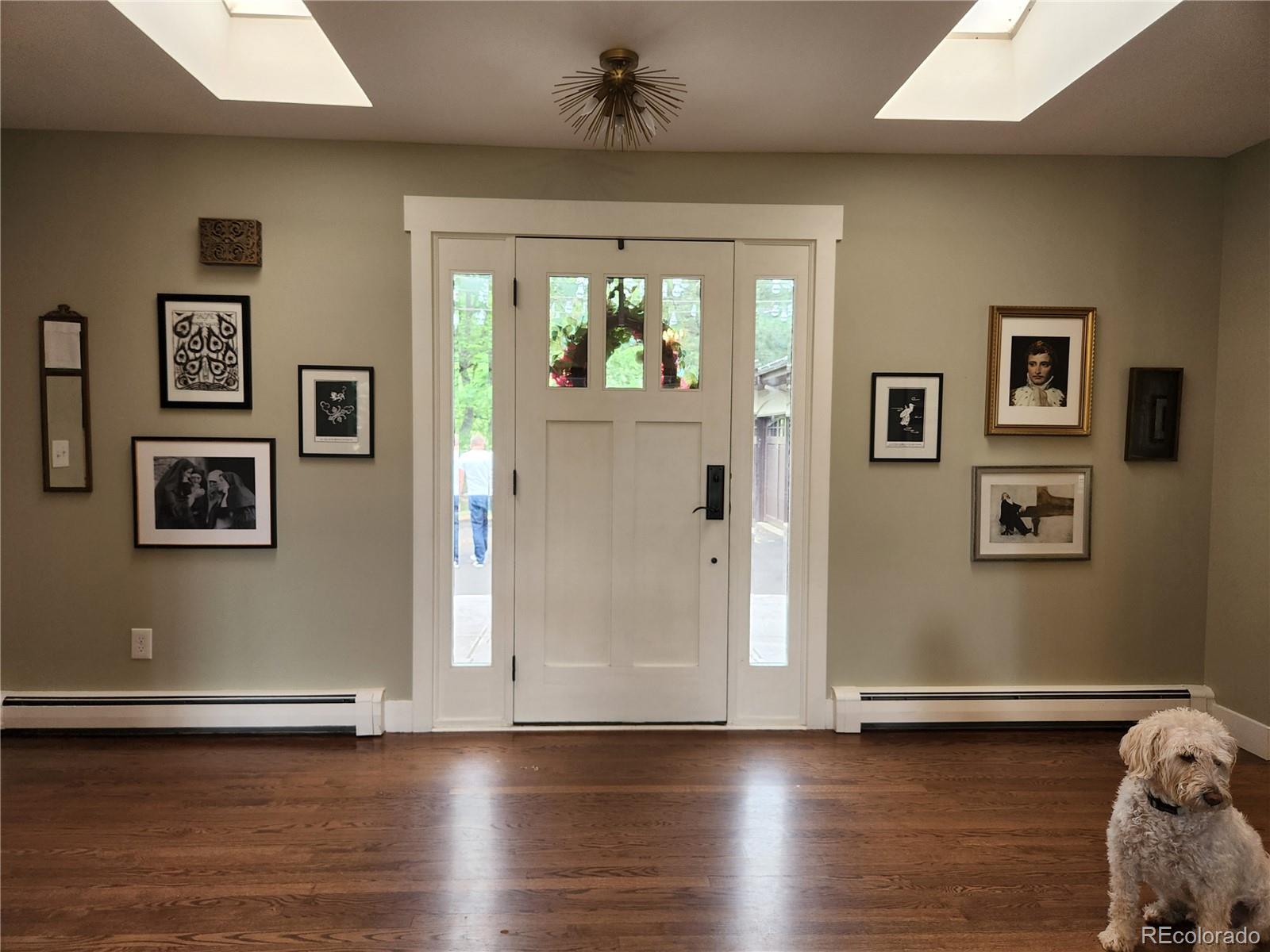 6650 Crestbrook Drive Morrison, CO 80465 - Photo 4 of 38 a view of livingroom with window and wooden floor