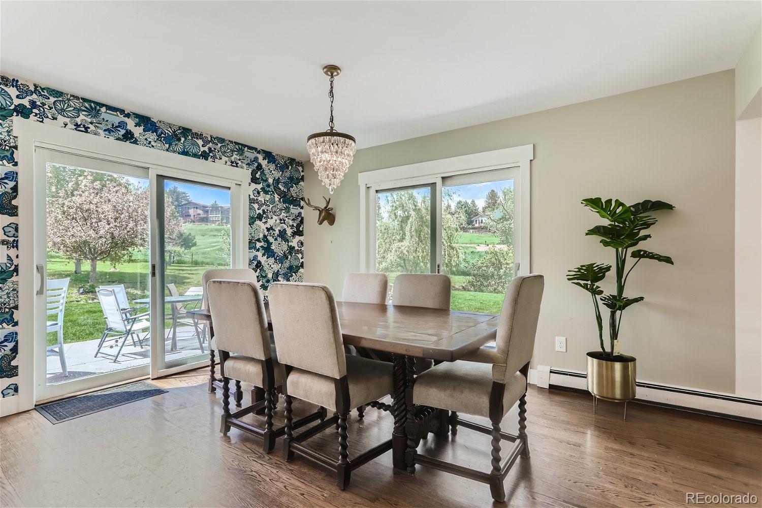 6650 Crestbrook Drive Morrison, CO 80465 - Photo 7 of 38 a view of a dining room with furniture window and wooden floor