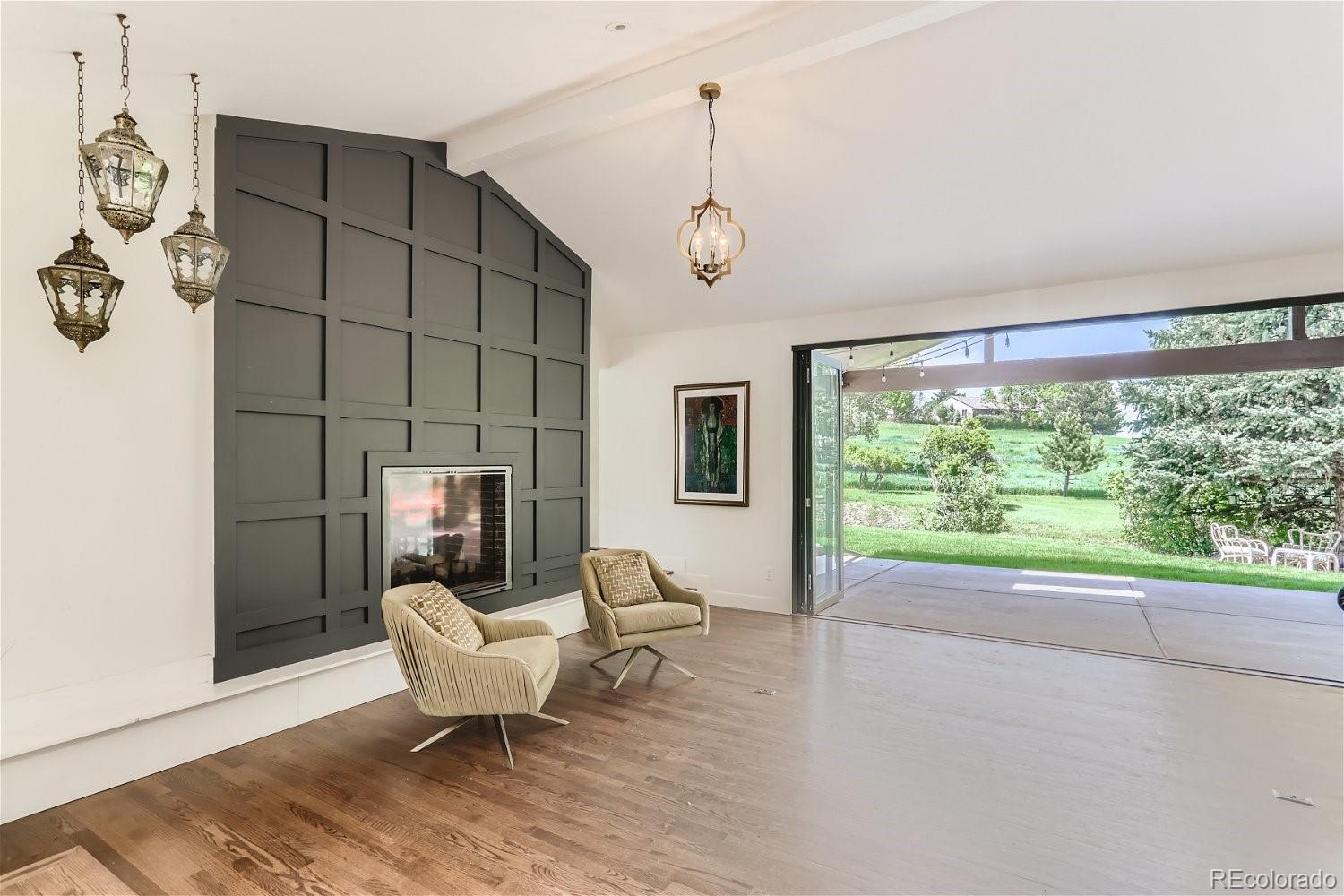 6650 Crestbrook Drive Morrison, CO 80465 - Photo 10 of 38 a living room with furniture a window and a table