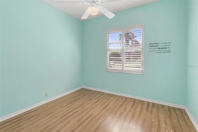 a view of a backyard with swimming pool