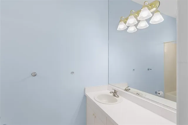 a view of a patio with table and chairs potted plants and palm tree