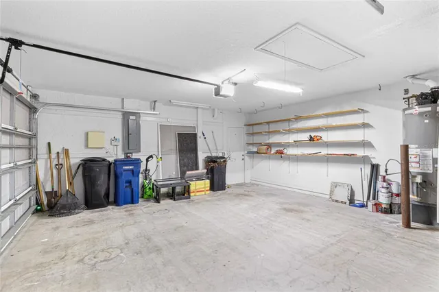 an aerial view of residential houses with outdoor space and city view