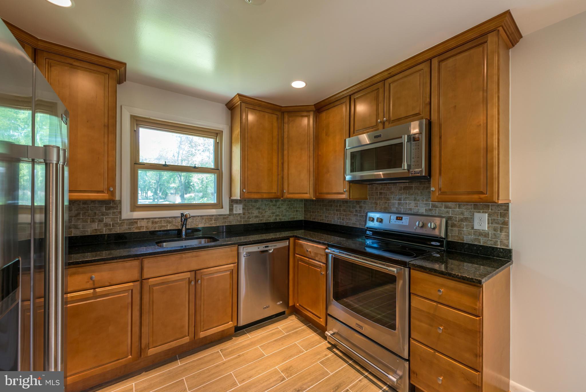 12430 Littleton Street Silver Spring, MD 20906 - Photo 7 of 28 New cabinets and new recessed lighting!
