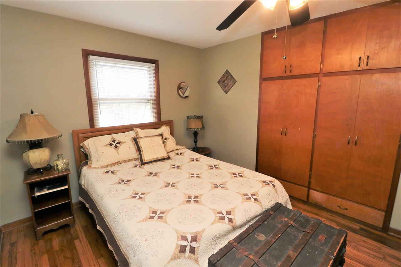 16127 Edwardsville Road Pecatonica, IL 61063 - Photo 14 of 26 a bedroom with a bed and a window