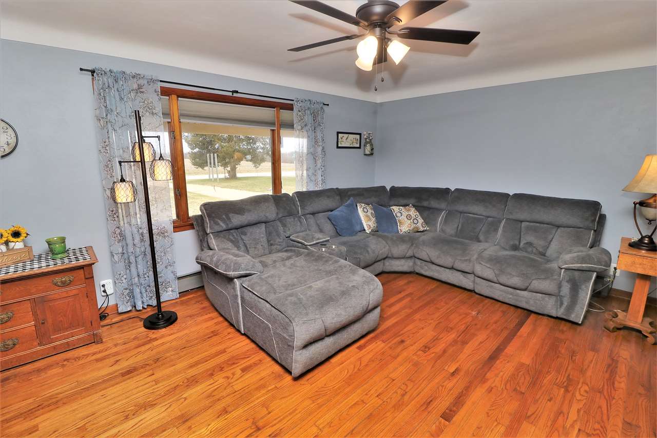 16127 Edwardsville Road Pecatonica, IL 61063 - Photo 2 of 26 a living room with furniture and a large window