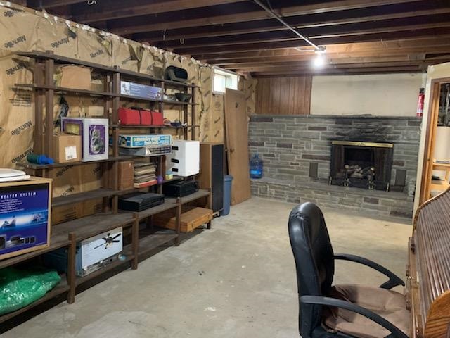 16127 Edwardsville Road Pecatonica, IL 61063 - Photo 22 of 26 a view of work space with furniture and fireplace