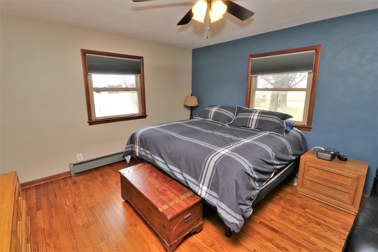 16127 Edwardsville Road Pecatonica, IL 61063 - Photo 10 of 26 a bedroom with a bed and a window