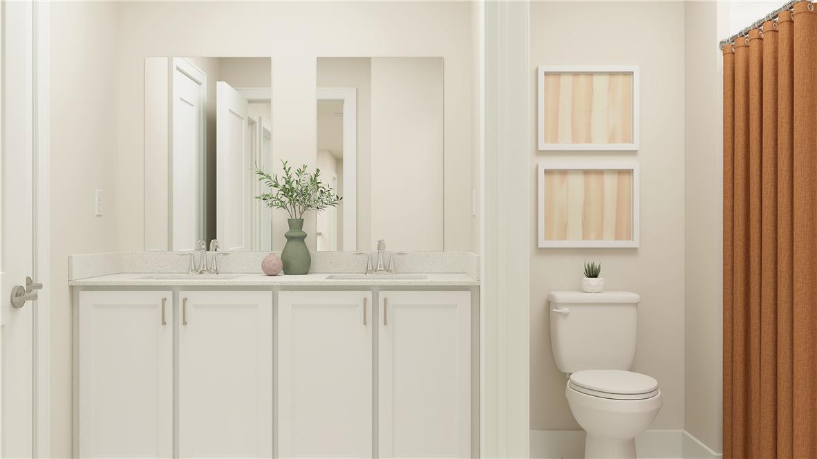 8445 Haaf Road Fogelsville, PA 18051 - Photo 21 of 28 A well-lit primary bathroom features a dual vanity with ample counter space and a modern toilet.