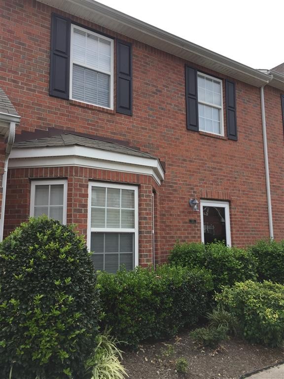 a brick building with a large windows