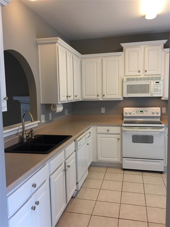 1101 Downs Boulevard, Unit 125 Franklin, TN 37064 - Photo 5 of 8 a kitchen with cabinets appliances and a sink
